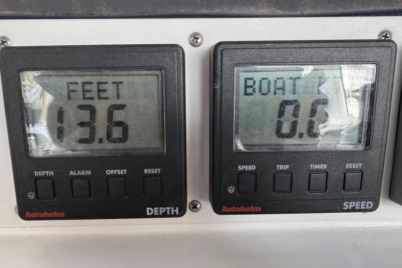Depth and speed gauges on a 1999 Hunter Passage 420 sailboat, showing 13.6 feet depth.