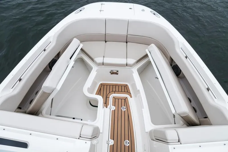 Manufacturer Provided Image: 2018 Boston Whaler 320 Vantage boat interior with cushioned seating and teak flooring.
