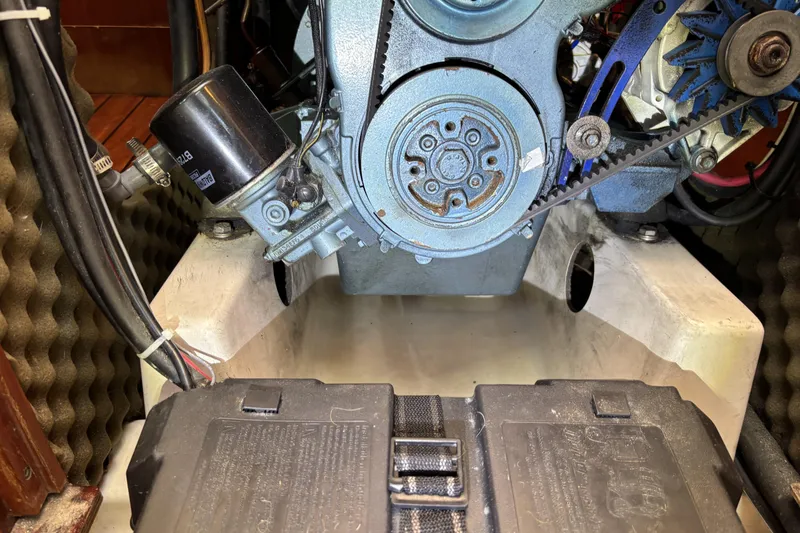 Engine compartment of a 1997 Beneteau Oceanis 400 sailboat, showing mechanical components.