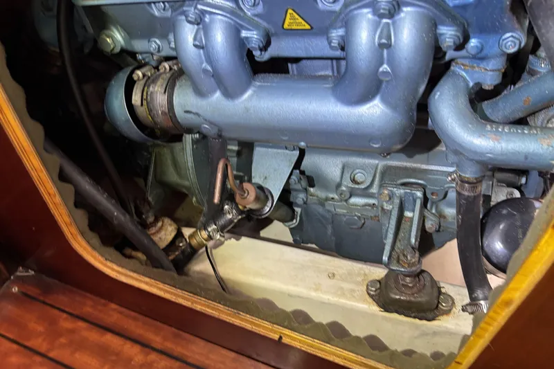 Engine compartment of a 1997 Beneteau Oceanis 400 sailboat, showcasing mechanical components.