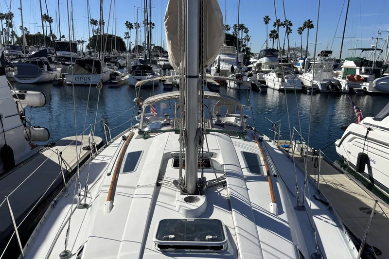 1997 Beneteau Oceanis 400 sailboat docked in a marina with other boats.