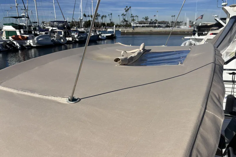 Beneteau Oceanis 400 sailboat deck, 1997 model, docked in a marina with clear skies.