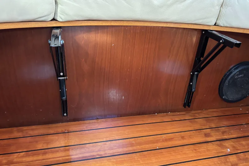 Interior of 1997 Beneteau Oceanis 400 yacht with wooden paneling and speaker.