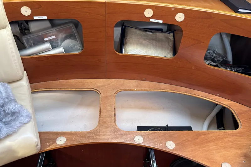 Interior view of a 1997 Beneteau Oceanis 400 sailboat with wooden storage compartments.