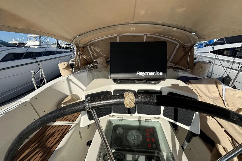 Cockpit view of 1997 Beneteau Oceanis 400 sailboat with Raymarine navigation system.