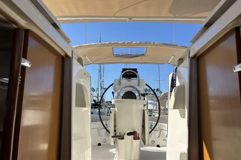 Interior view of 1997 Beneteau Oceanis 400 sailboat cockpit with steering wheel.