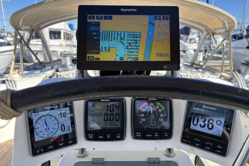 Cockpit of 1997 Beneteau Oceanis 400 with Raymarine navigation instruments and chartplotter display.
