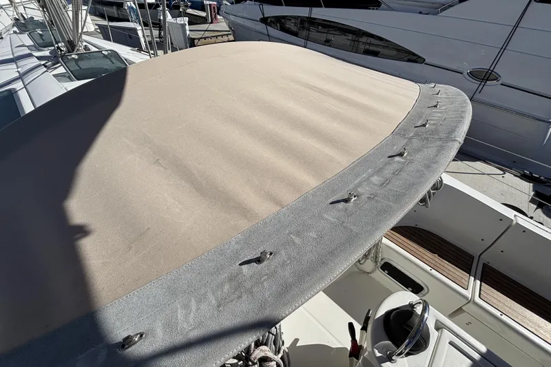 Beneteau Oceanis 400 sailboat cockpit with beige canvas cover, 1997 model.