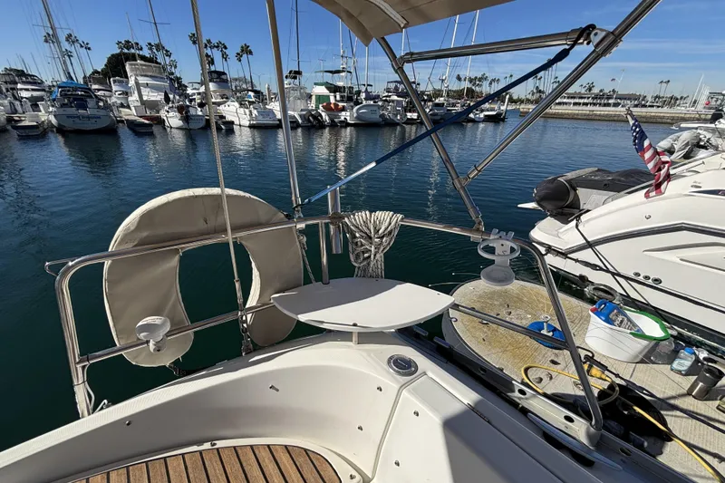 Beneteau Oceanis 400 sailboat docked in marina, 1997 model, with clear blue water.