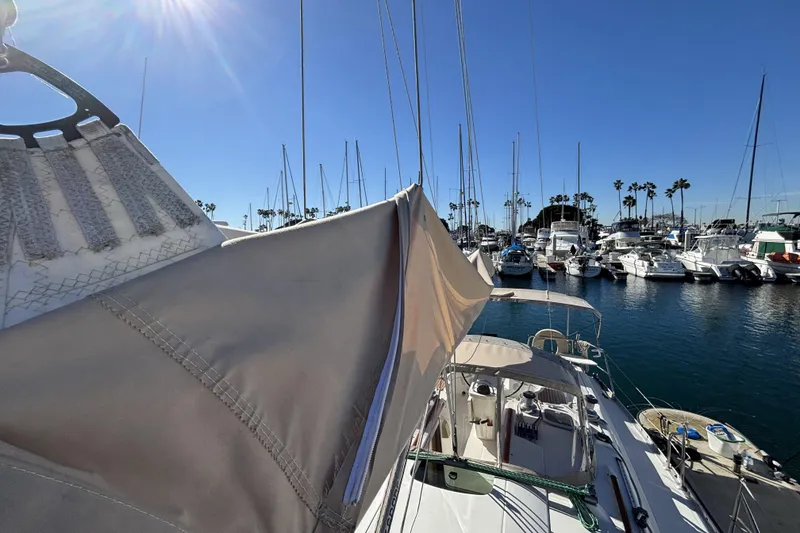 Beneteau Oceanis 400 sailboat docked in a sunny marina, 1997 model.