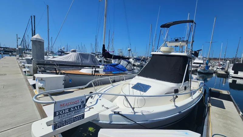 1992 Luhrs Tournament 300 boat for sale at marina dock.
