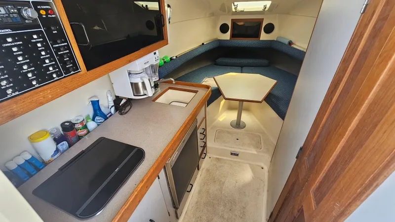 1992 Luhrs Tournament 300 cabin interior with kitchenette and seating area.