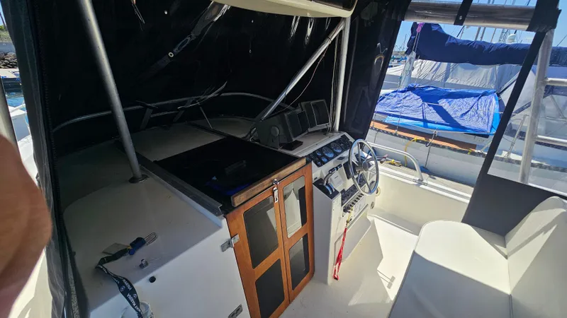1992 Luhrs Tournament 300 boat cockpit with steering wheel and control panel.