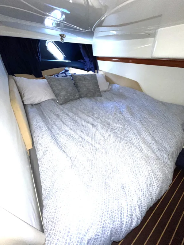 Interior of 2004 Cranchi Endurance 41 yacht with cozy bed.