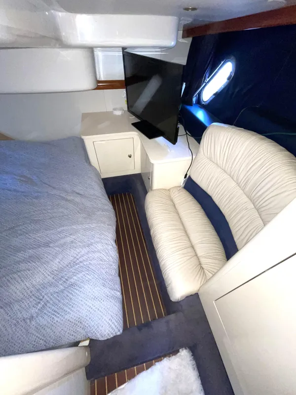 Interior of 2004 Cranchi Endurance 41 yacht with bed and sofa.
