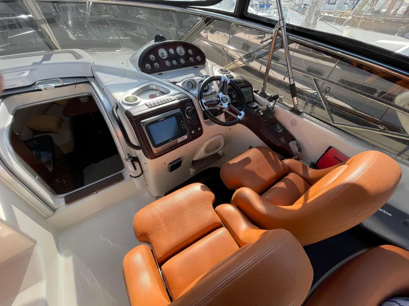 Interior of 2004 Cranchi Endurance 41 with brown leather seats.