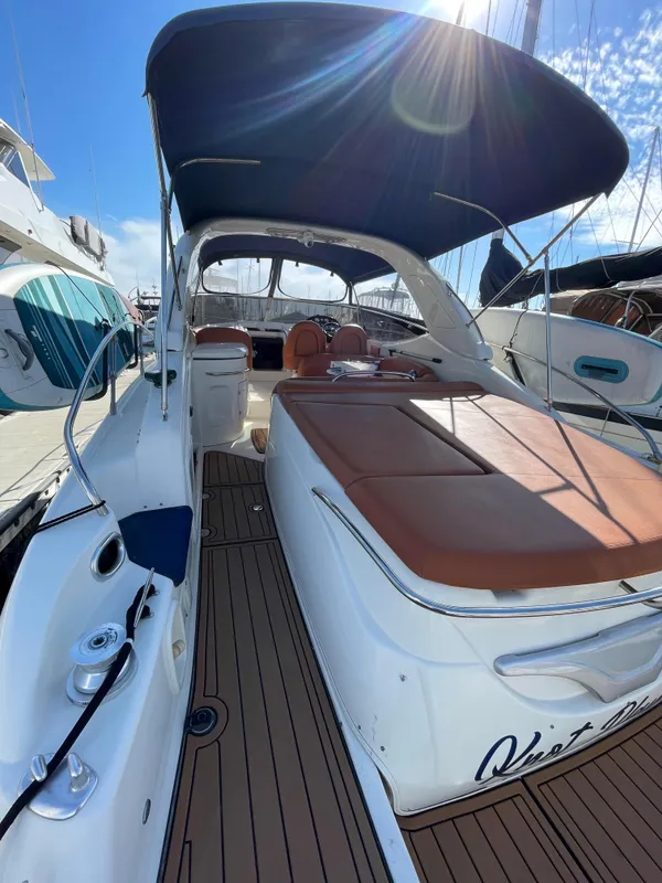 2004 Cranchi Endurance 41 yacht with sunshade in harbor.