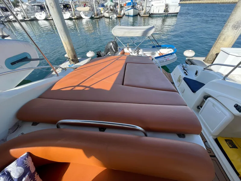 2004 Cranchi Endurance 41 with sunbed in harbor.