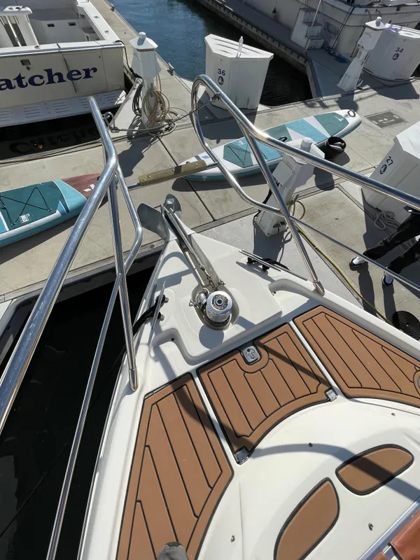 Bow of a 2004 Cranchi Endurance 41 boat docked in marina.