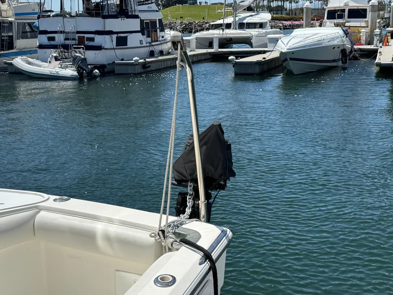 2003 Mediterranean 38 Convertible yacht docked in a marina with other boats.
