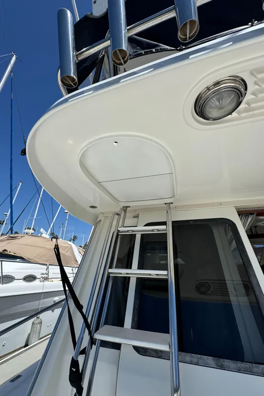 2003 Mediterranean 38 Convertible yacht ladder and deck view.