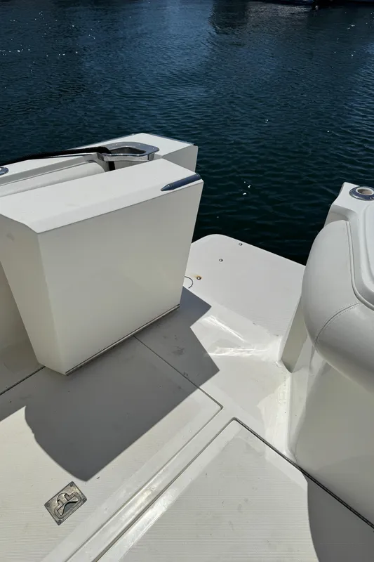 2003 Mediterranean 38 Convertible yacht deck with white seating and water view.