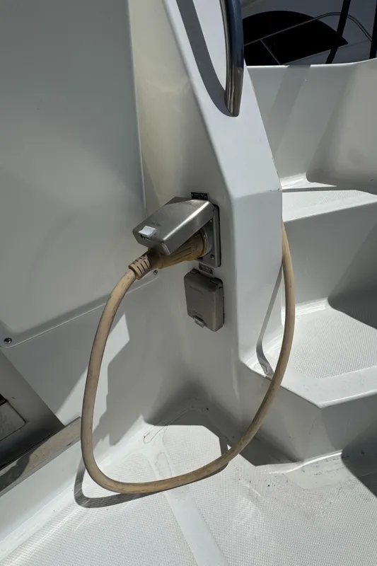 Power outlet on 2003 Mediterranean 38 Convertible boat with cable connected.