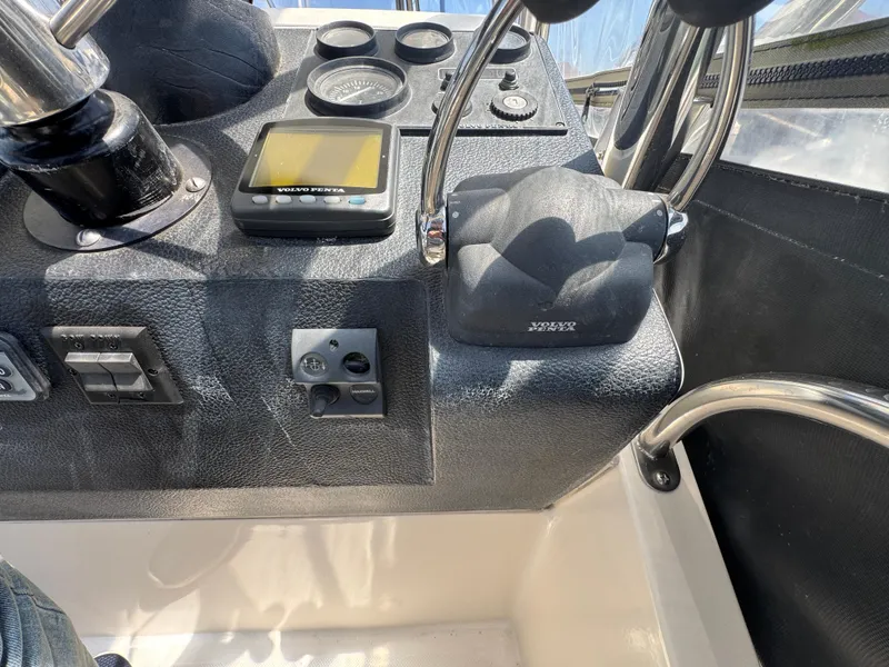 Control panel of a 2003 Mediterranean 38 Convertible boat with gauges and switches.