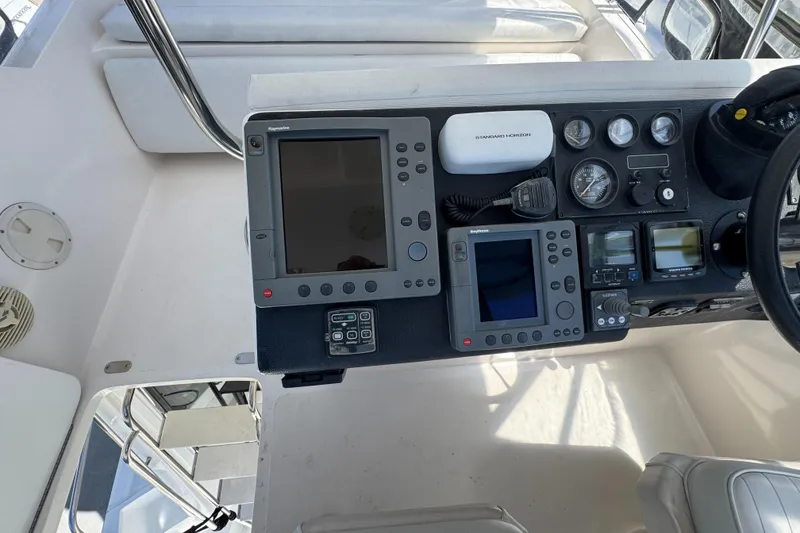 Control panel of a 2003 Mediterranean 38 Convertible yacht with navigation instruments.