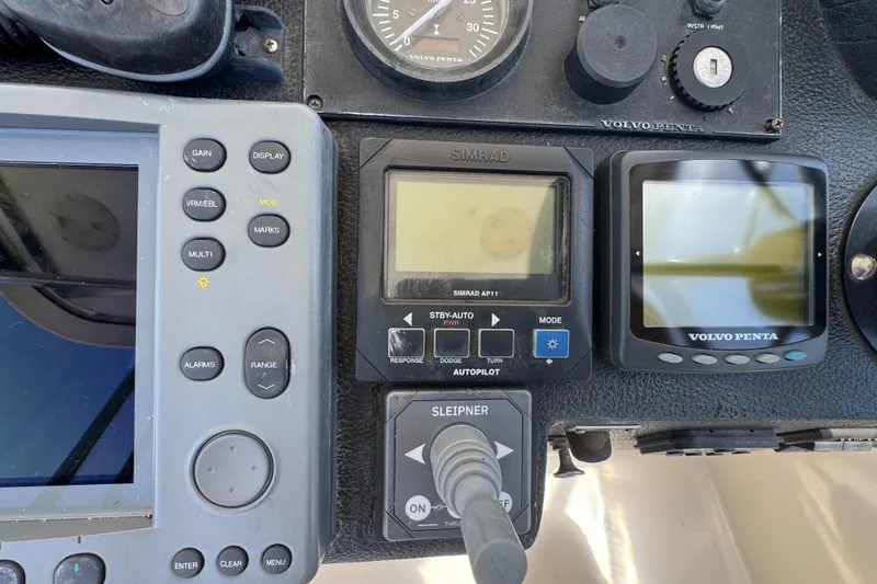 Control panel of a 2003 Mediterranean 38 Convertible boat with navigation instruments.