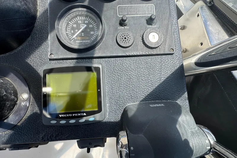 Control panel of a 2003 Mediterranean 38 Convertible boat with Volvo Penta display.