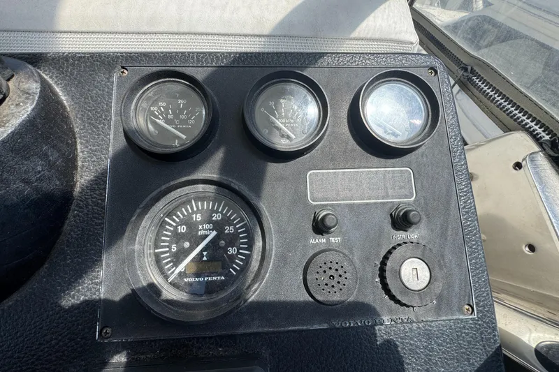 Instrument panel of a 2003 Mediterranean 38 Convertible boat with gauges and controls.