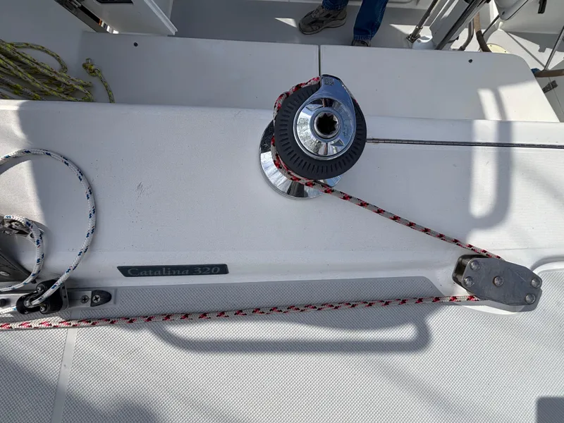 Winch and ropes on a 2005 Catalina 320 sailboat deck.