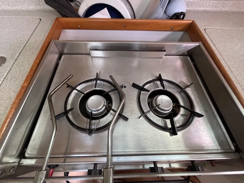 Two-burner stainless steel stove on a 2005 Catalina 320 yacht.