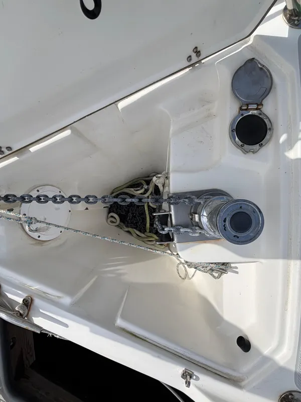 Anchor chain and windlass on a 2005 Catalina 320 sailboat deck.