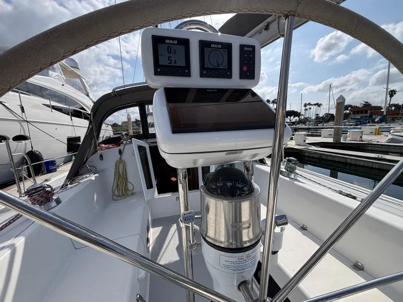 Cockpit of 2005 Catalina 320 sailboat with navigation instruments, docked at marina.