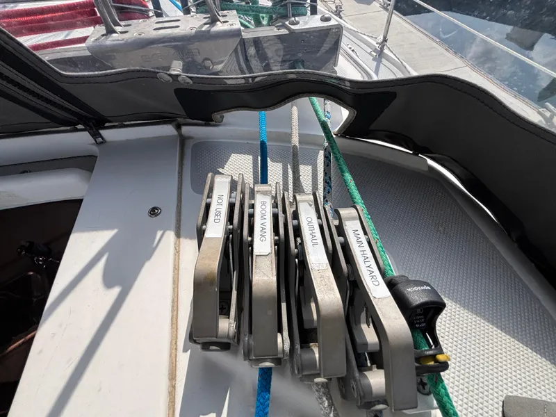 Sailboat deck with labeled rope clutches on a 2005 Catalina 320.