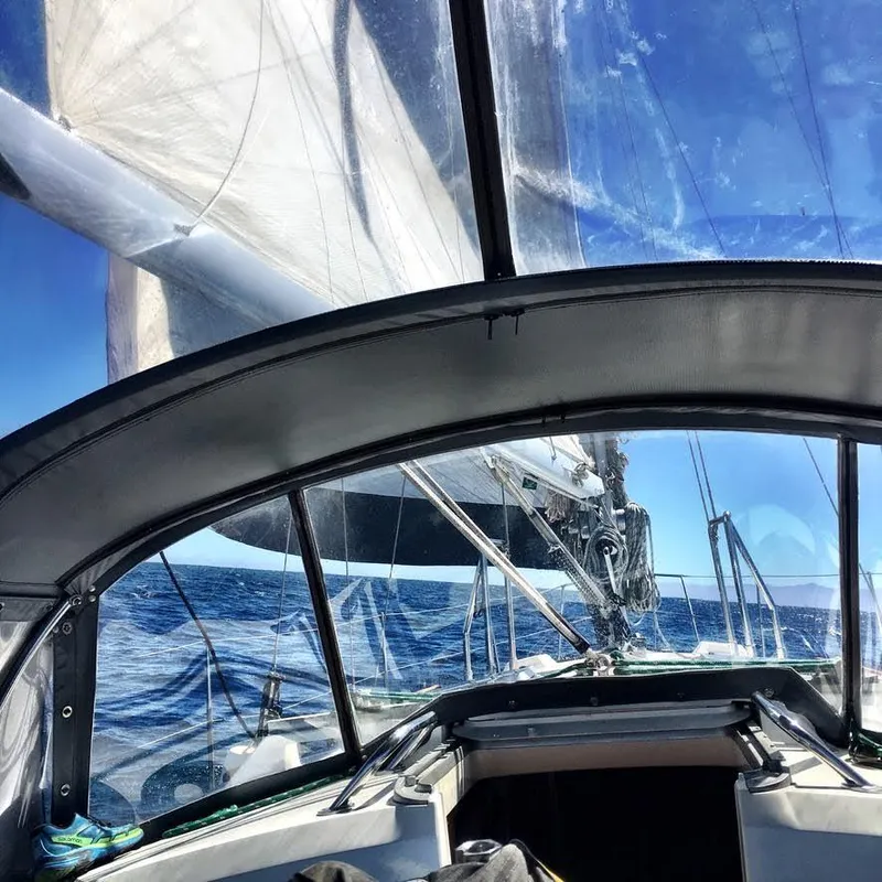 Sailing on a 1987 Norseman 400 yacht with clear blue skies and ocean.