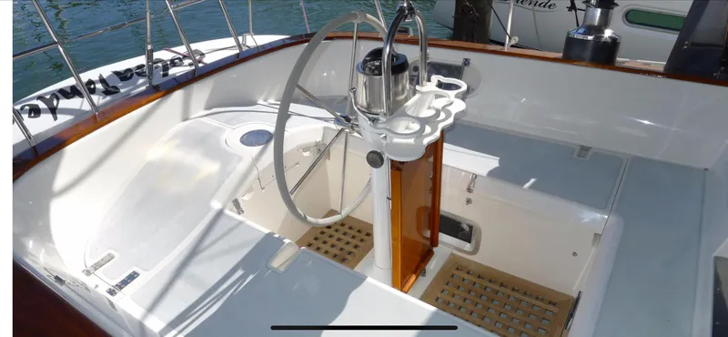 Cockpit of 1987 Norseman 400 sailboat with steering wheel and wooden accents.