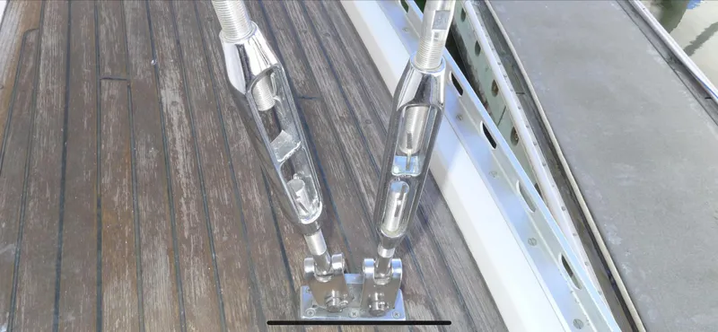 Close-up of Norseman 400 yacht rigging hardware on wooden deck, 1987 model.