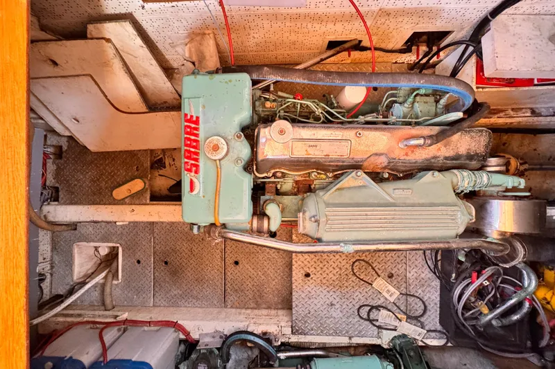 Engine room of 1983 Sea Ranger 45 Sun Deck with Sabre engine components.