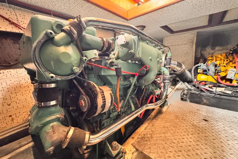 Engine room of 1983 Sea Ranger 45 Sun Deck yacht, showcasing detailed machinery.