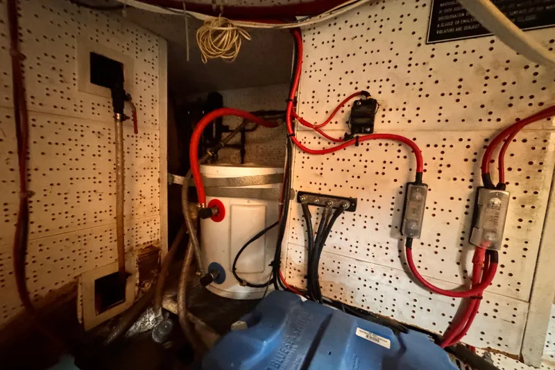 Engine room wiring and components of a 1983 Sea Ranger 45 Sun Deck boat.