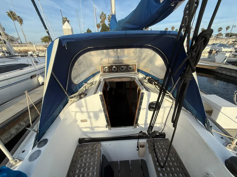 Cockpit of a 1980 Rival 32 sailboat docked in marina.