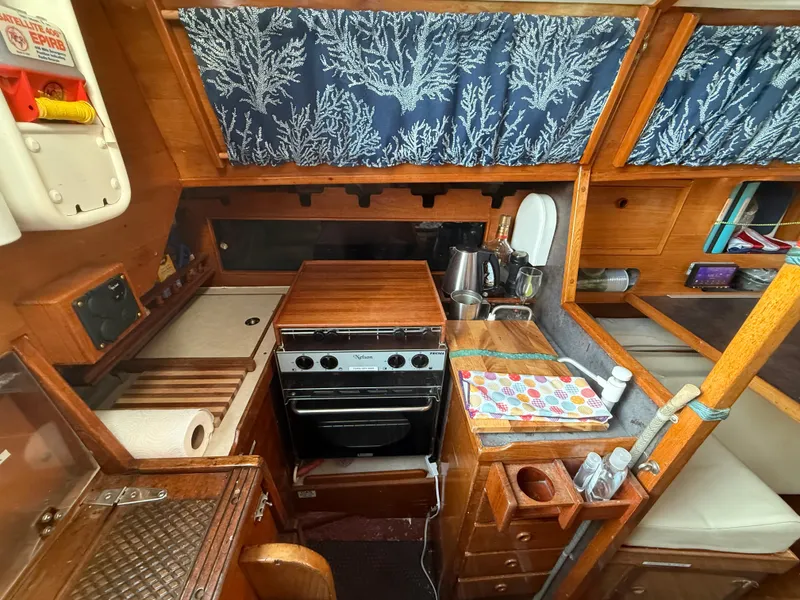 Interior of a 1980 Rival 32 yacht featuring a kitchen.