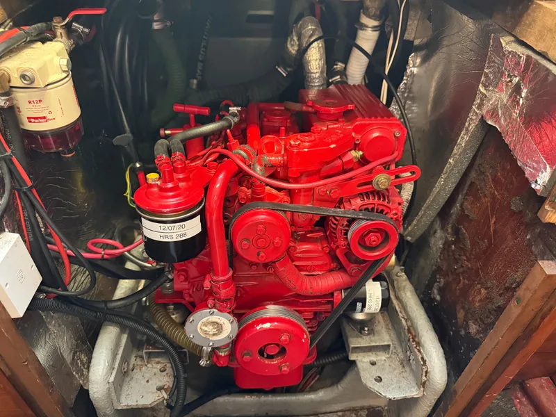1980 Rival 32 engine, painted bright red.