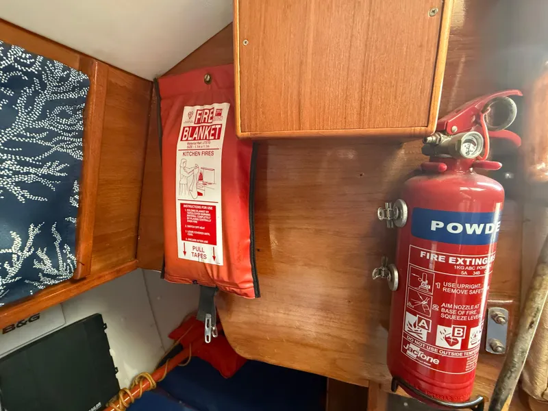 Fire extinguisher and blanket in 1980 Rival 32 boat.