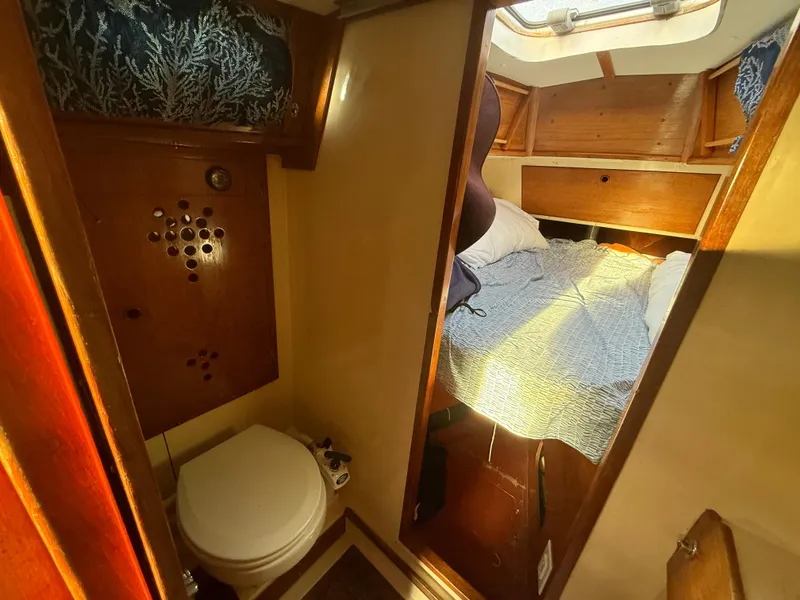 Interior of a 1980 Rival 32 yacht with bed and toilet.