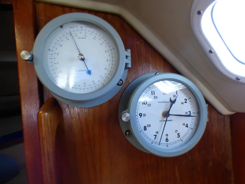 Barometer and clock on 1984 Catalina 36 Sloop wooden interior.