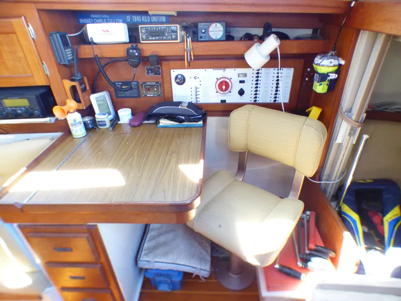 Navigation station of 1984 Catalina 36 Sloop with control panel and equipment.